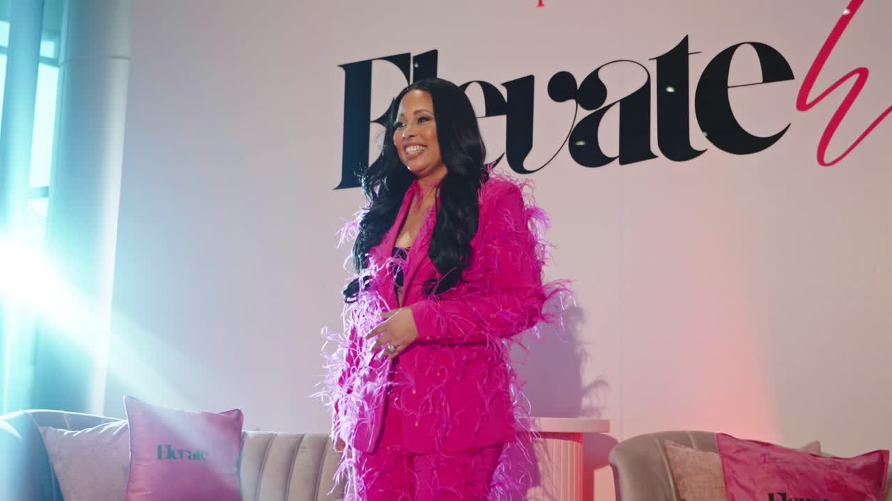 Zena speaking at the ElevateHER Convention