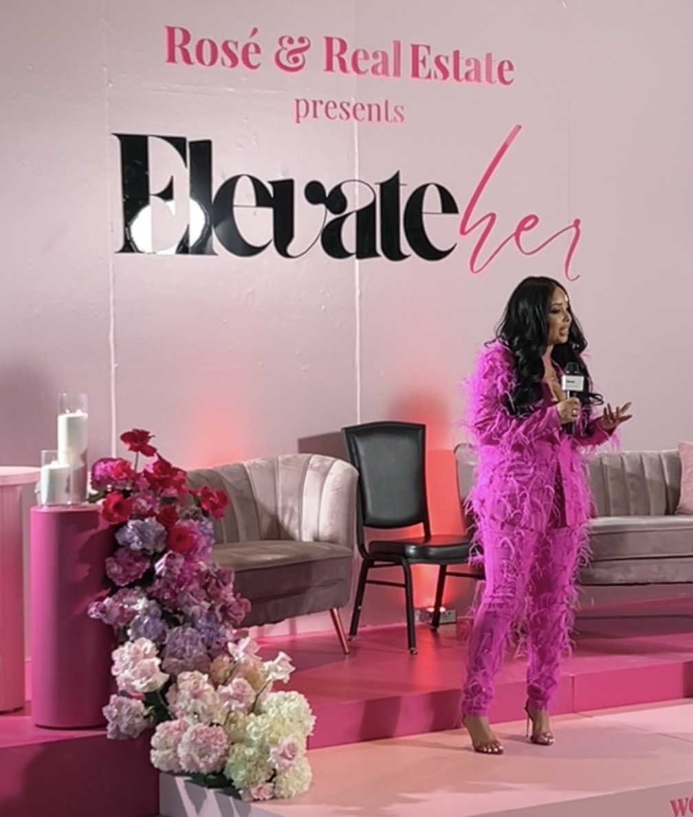 Zena Dixon speaking on stage at the ElevateHER Convention
