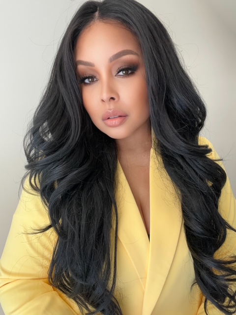Portrait of founder Zena Dixon in a yellow blazer